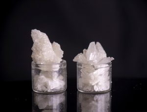 CBD crystals in two small clear containers